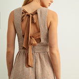Back detail of Mila Gingham Bow Back Wide Leg Jumpsuit in Brown showing bow ties