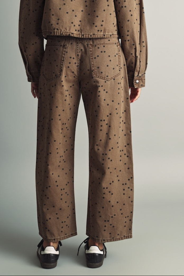 Back view of Miou Muse cocoa-brown polka dot barrel jeans showing back pockets and relaxed legs