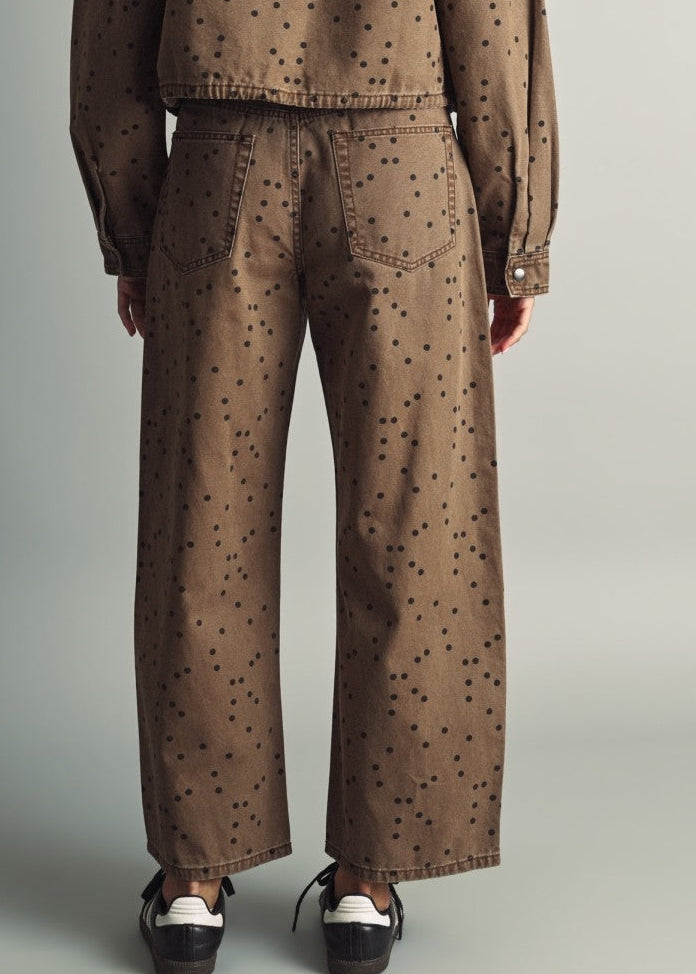 Back view of Miou Muse cocoa-brown polka dot barrel jeans showing back pockets and relaxed legs