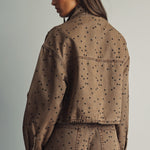 Back view of Miou Muse cocoa and black polka dot jacket showing its relaxed, boxy fit