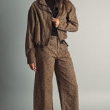 Miou Muse cocoa and black polka dot funnel-neck jacket styled with matching brown polka dot pants