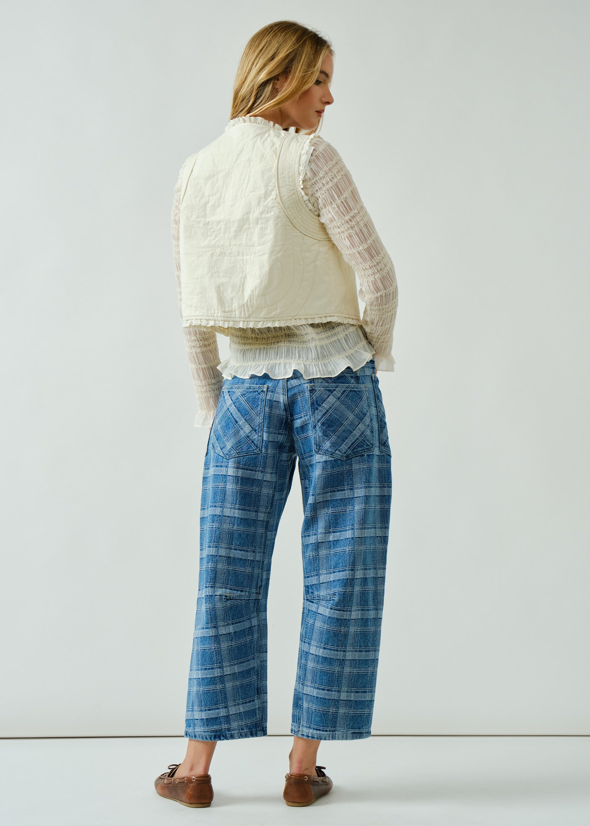Back view of the Moxie Barrel Eyelet Jeans in blue plaid