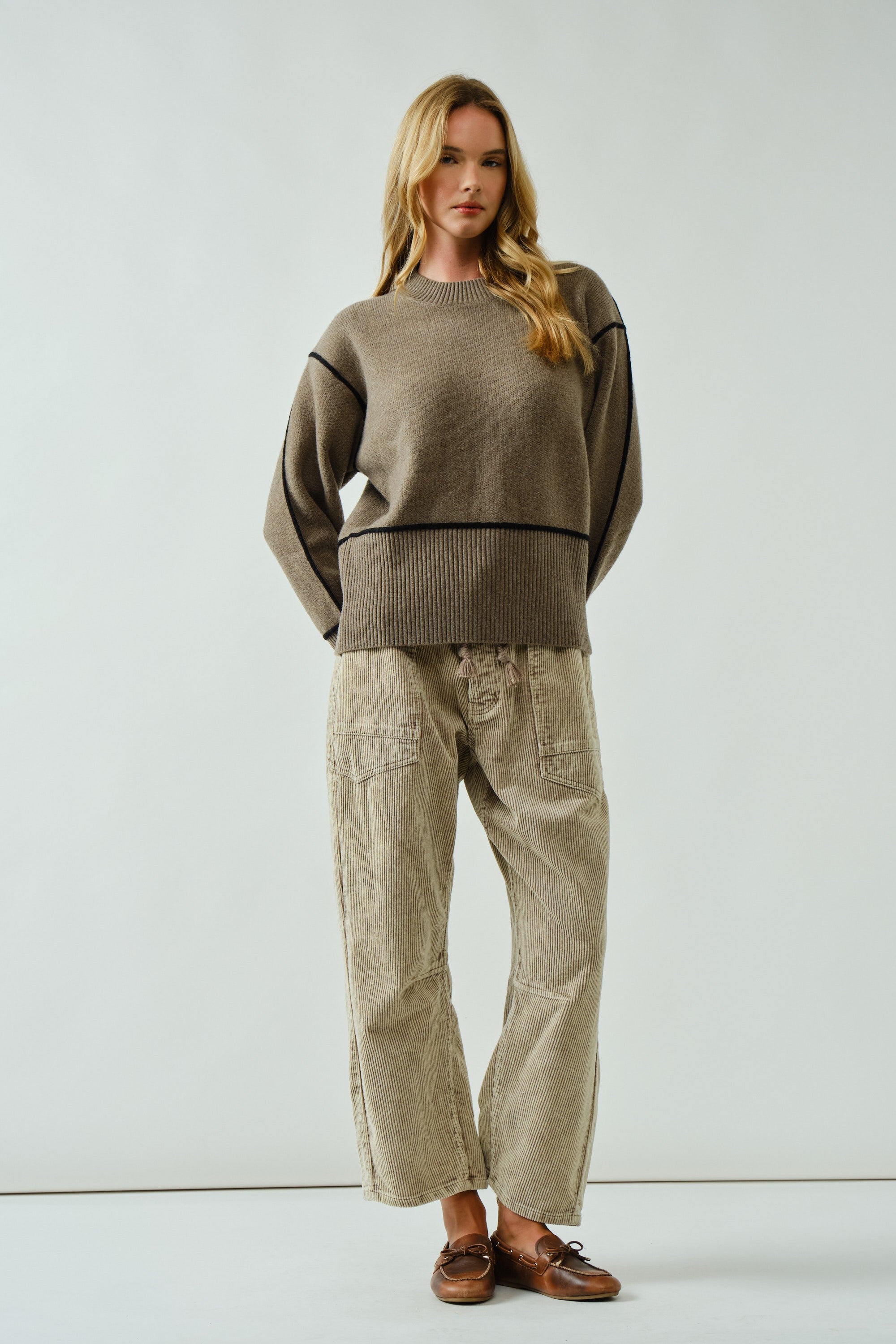 Woman wearing the Moxie Barrel Eyelet Jeans in corduroy dove — relaxed barrel silhouette with drawstring waist and cropped fit.