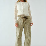 Woman wearing the Moxie Barrel Eyelet Jeans in corduroy olive — relaxed barrel silhouette with drawstring waist.