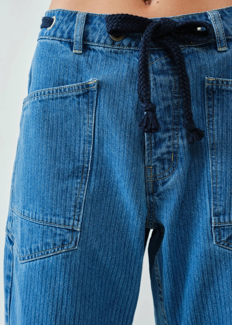 Close-up detail of the jacquard stripe eyelet fabric and front construction