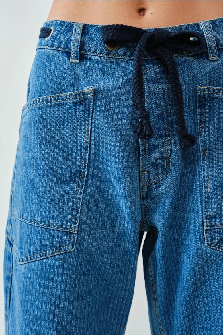 Close-up detail of the jacquard stripe eyelet fabric and front construction