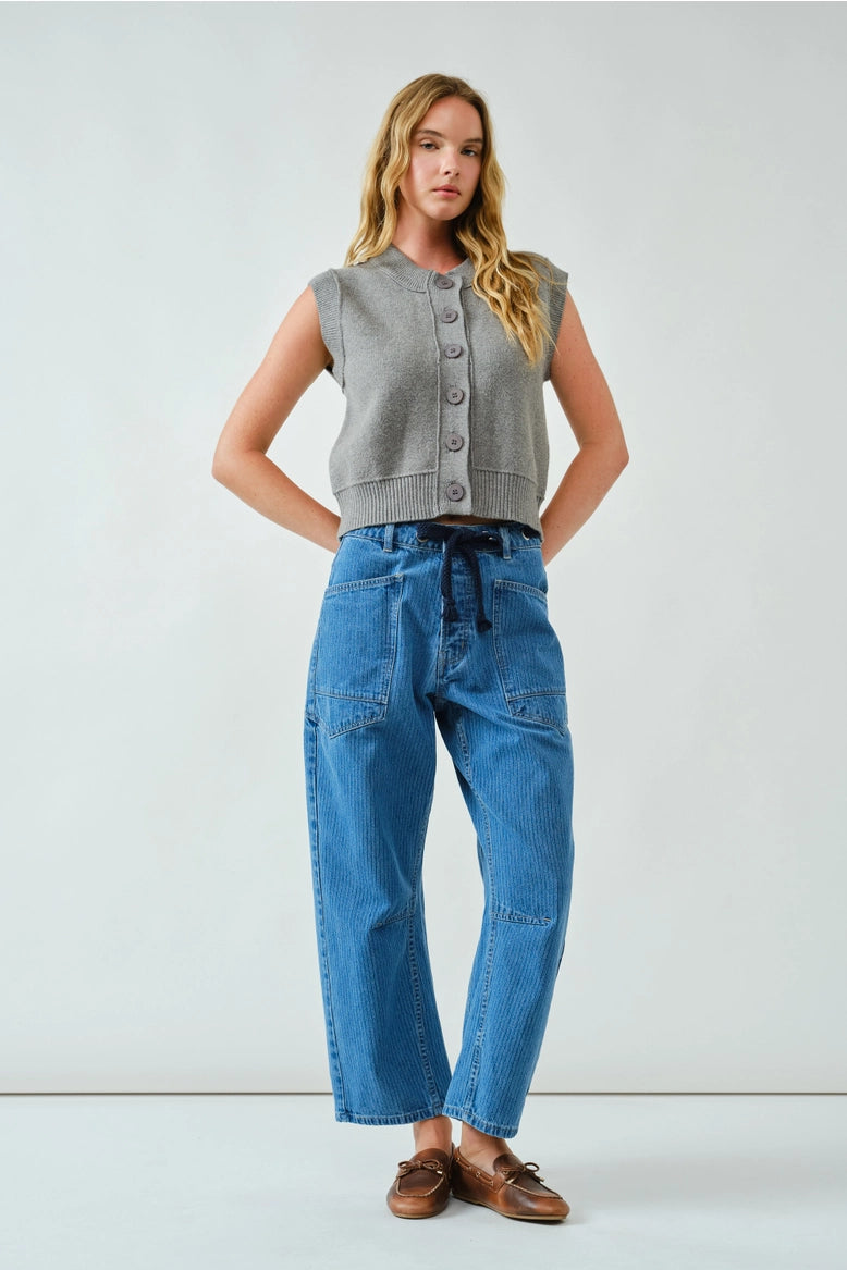 Front portrait of model wearing the Moxie Barrel Eyelet Jeans in medium jacquard stripes