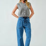 Front portrait of model wearing the Moxie Barrel Eyelet Jeans in medium jacquard stripes