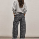 Back view of Moxie Barrel Eyelet Jeans in Polka Dot Black with all-over white polka dot print and relaxed barrel fit.