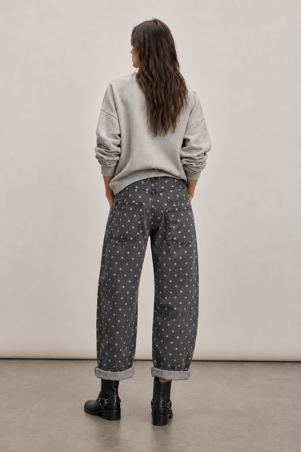 Back view of Moxie Barrel Eyelet Jeans in Polka Dot Black with all-over white polka dot print and relaxed barrel fit.