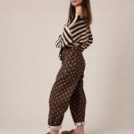 Back view of Moxie Barrel Eyelet Jeans in Polka Dot Brown with cropped slouchy barrel silhouette