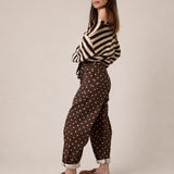 Back view of Moxie Barrel Eyelet Jeans in Polka Dot Brown with cropped slouchy barrel silhouette