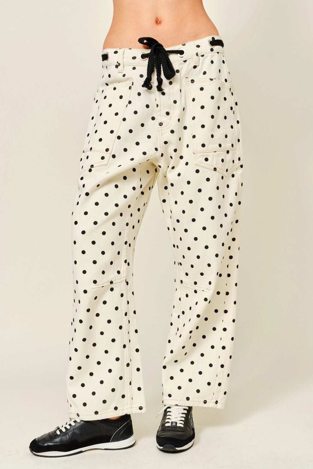 Front view of Moxie Barrel Eyelet Jeans in polka dot cream with eyelet waist detail