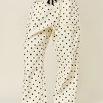 Front view of Moxie Barrel Eyelet Jeans in polka dot cream with eyelet waist detail