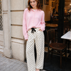 Woman wearing Moxie Barrel Eyelet Jeans in polka dot cream with a pink cardigan