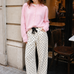 Woman wearing Moxie Polka Dot Barrel Jeans in Cream with a pink cardigan