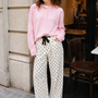 Woman wearing Moxie Polka Dot Barrel Jeans in Cream with a pink cardigan