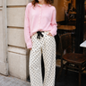 Woman wearing Moxie Polka Dot Barrel Jeans in Cream with a pink cardigan