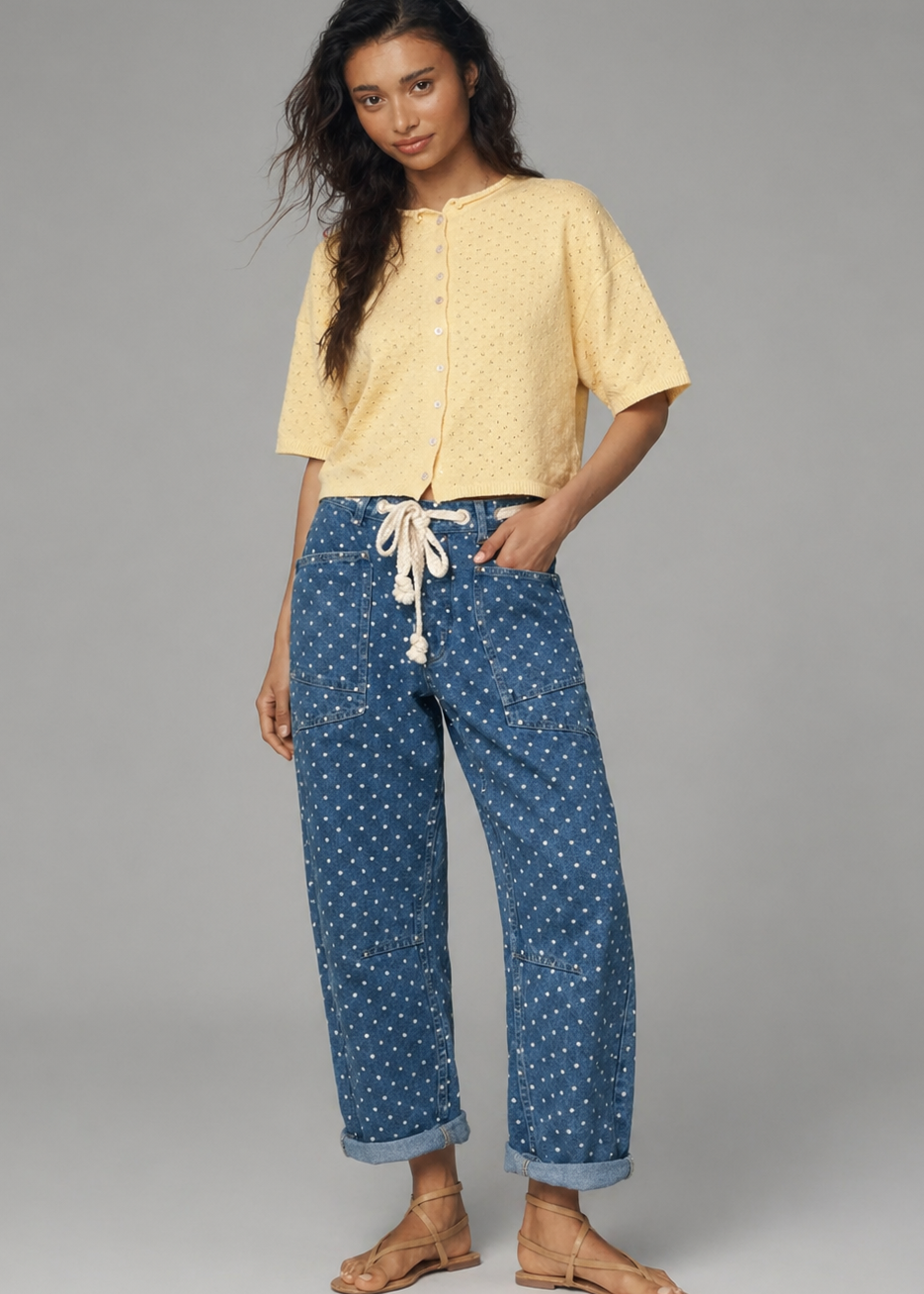 Woman wearing Moxie Polka Dot Barrel Jeans in Denim and yellow top styled in a full outfit on a gray background