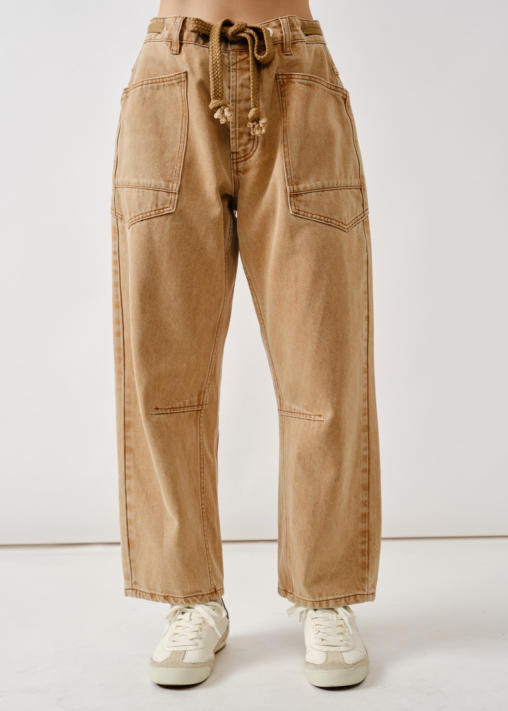 Front flat view of the Moxie Barrel Eyelet Jeans in rust