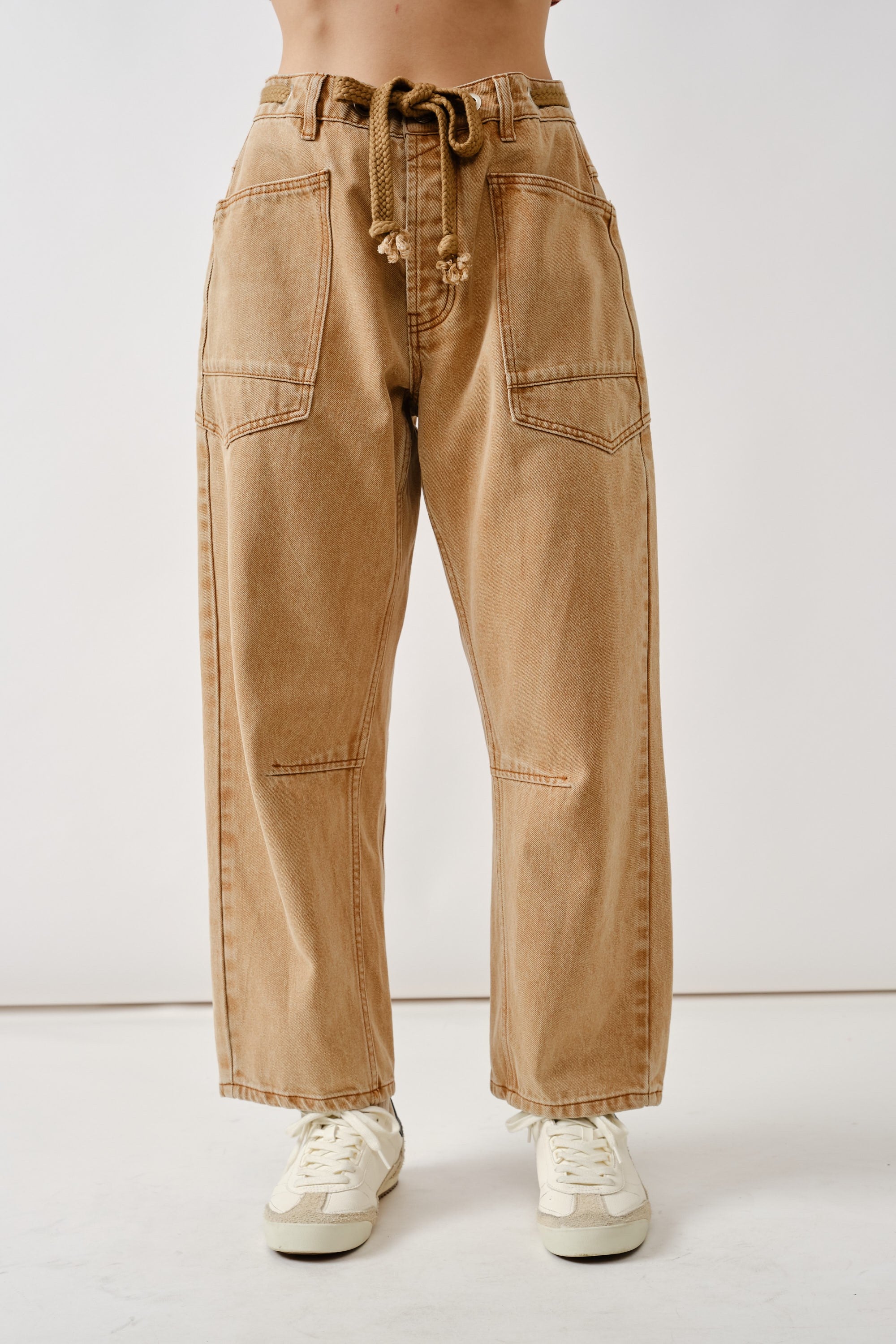 Front flat view of the Moxie Barrel Eyelet Jeans in rust