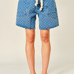 Front view of Moxie Barrel Shorts in Denim Dot with relaxed barrel fit, polka dot print, drawstring waist, and oversized pockets.
