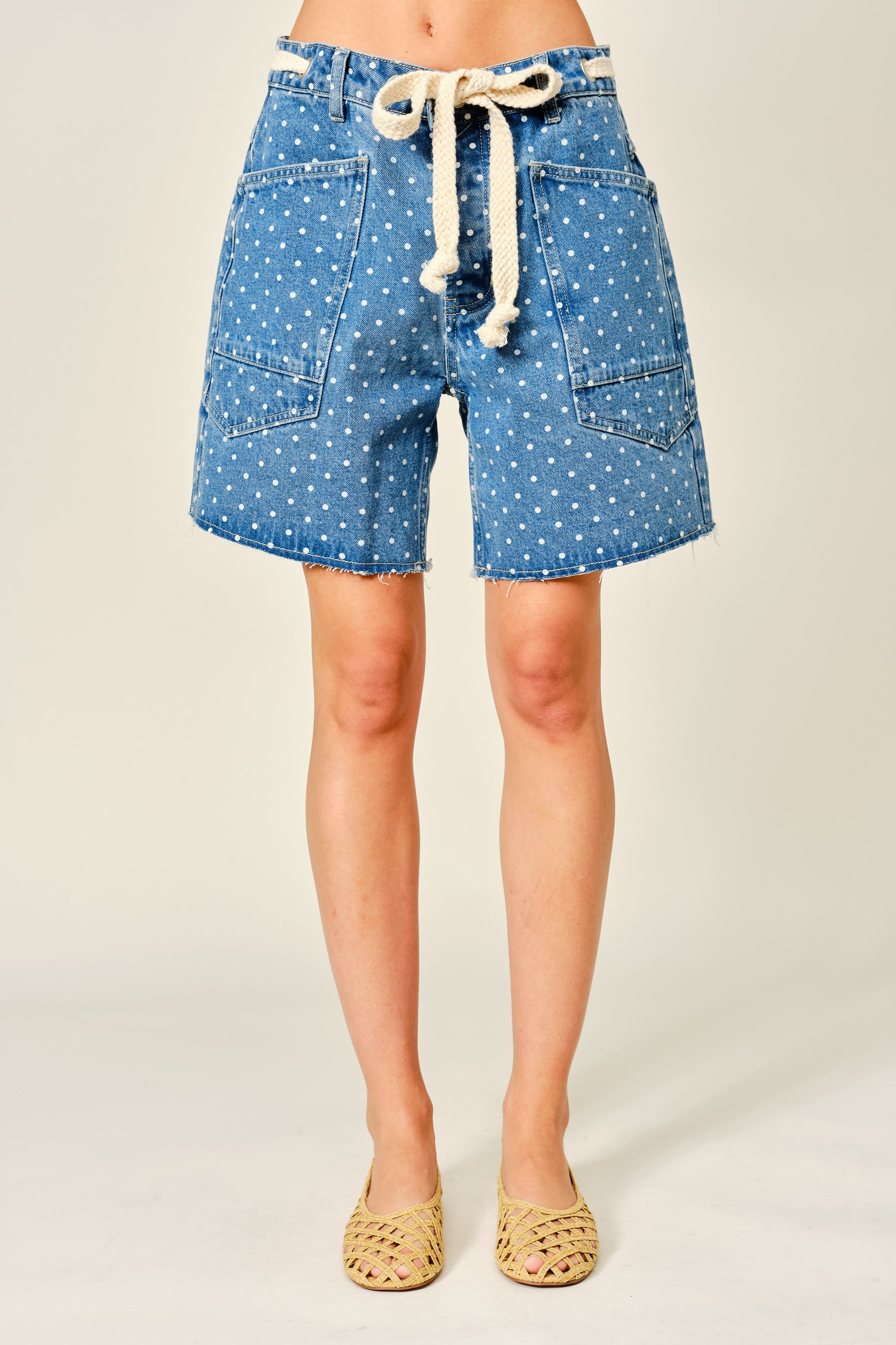 Front view of Moxie Barrel Shorts in Denim Dot with relaxed barrel fit, polka dot print, drawstring waist, and oversized pockets.