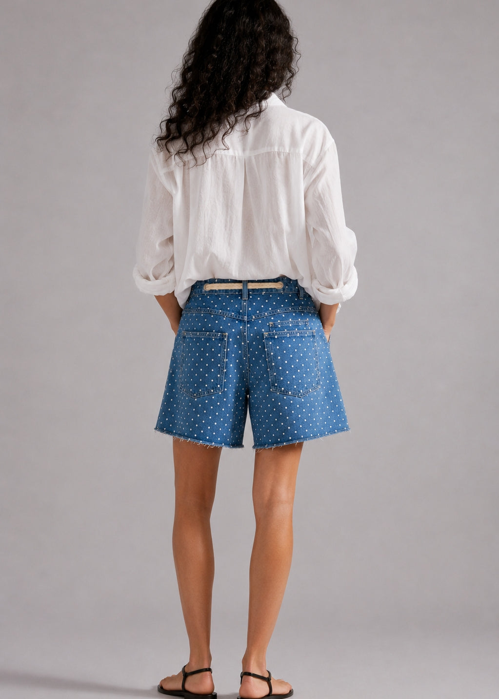 Model wearing Moxie Barrel Shorts in Denim Dot styled with an easy everyday top for a relaxed casual outfit. - back view