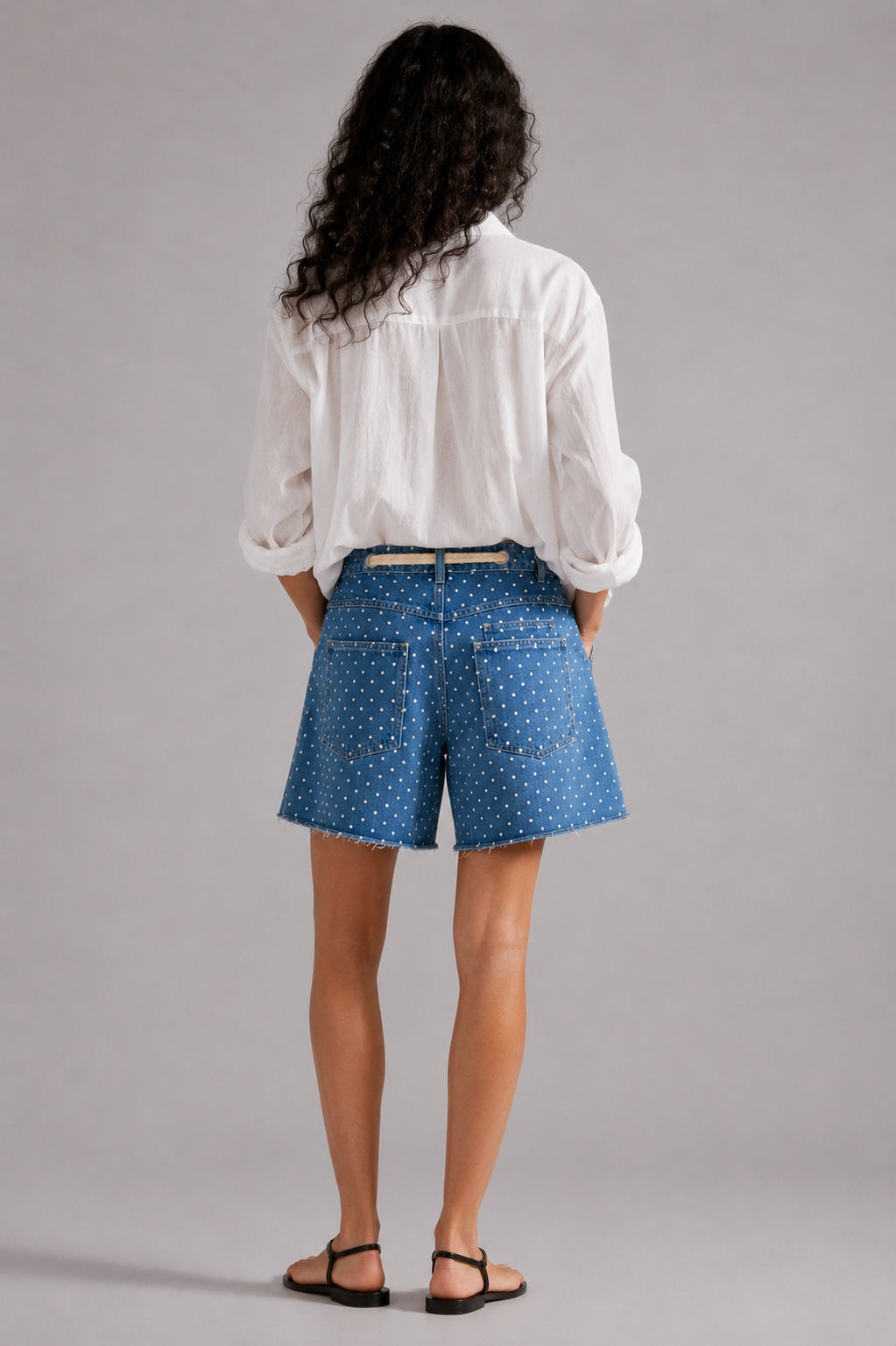 Model wearing Moxie Barrel Shorts in Denim Dot styled with an easy everyday top for a relaxed casual outfit. - back view