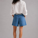 Model wearing Moxie Barrel Shorts in Denim Dot styled with an easy everyday top for a relaxed casual outfit. - back view