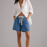 Model wearing Moxie Barrel Shorts in Denim Dot styled with an easy everyday top for a relaxed casual outfit.