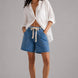 Model wearing Moxie Barrel Shorts in Denim Dot styled with an easy everyday top for a relaxed casual outfit.