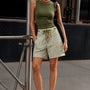 Woman wearing Moxie Barrel Shorts in Olive Stripe styled with an easy everyday outfit