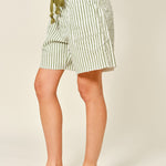 Moxie Barrel Shorts in Olive Stripe, side view showing the relaxed barrel fit and slouchy silhouette