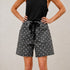 Front view of Moxie Barrel Shorts in charcoal black with white polka dots