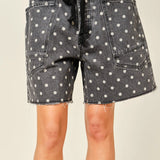 Front view of Moxie Barrel Shorts in charcoal black with white polka dots - closer-up