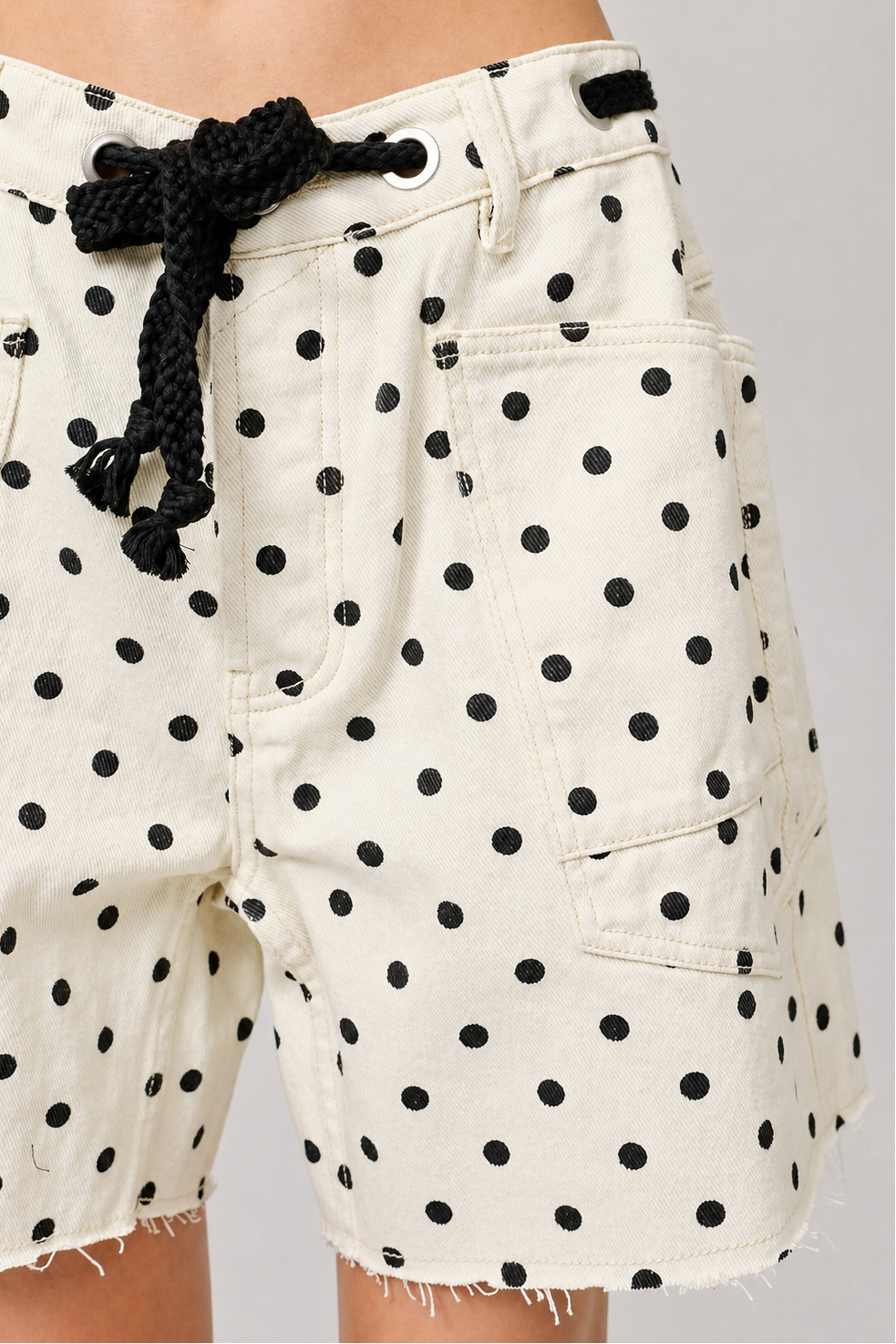 Moxie Barrel Shorts in Polka Dot Cream on model, close-up front details view