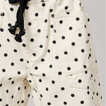 Moxie Barrel Shorts in Polka Dot Cream on model, close-up front details view
