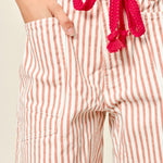 Moxie Barrel Shorts in Rust Stripe, front view with corded drawstring waist and oversized pockets - close up view