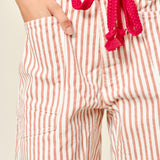Moxie Barrel Shorts in Rust Stripe, front view with corded drawstring waist and oversized pockets - close up view
