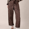 Moxie Barrel Eyelet Jeans in Polka Dot Brown front view with relaxed barrel leg fit and white dot print - front-view-first-image