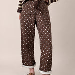 Moxie Barrel Eyelet Jeans in Polka Dot Brown front view with relaxed barrel leg fit and white dot print - front-view-first-image