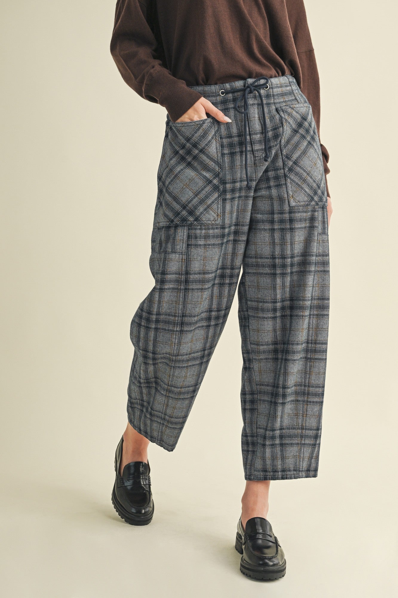 Full-length view of Nice Choice pull-on plaid pants highlighting barrel-leg shape and ankle length