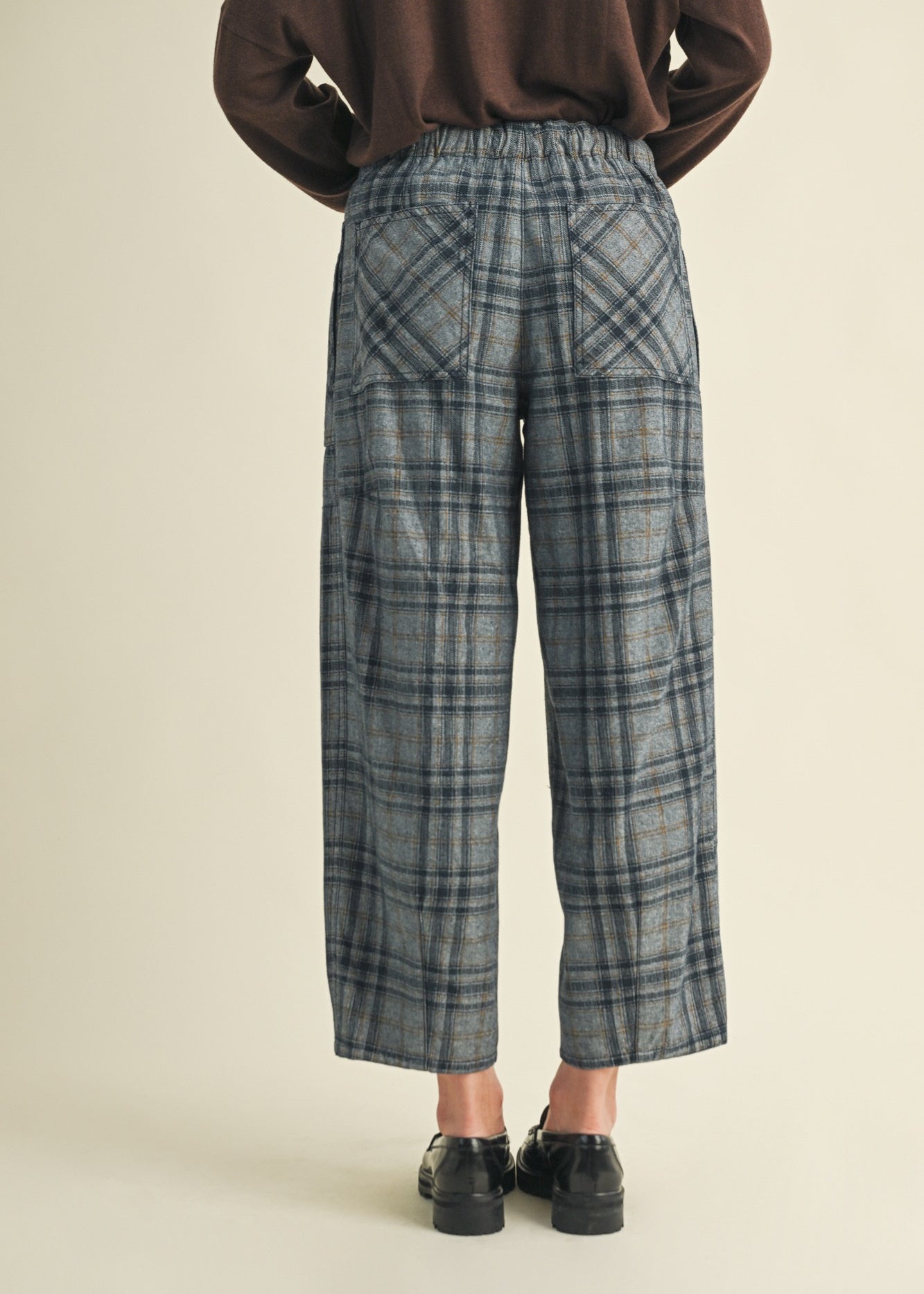 Angled back view of Nice Choice pull-on plaid pants in washed denim with classic plaid print