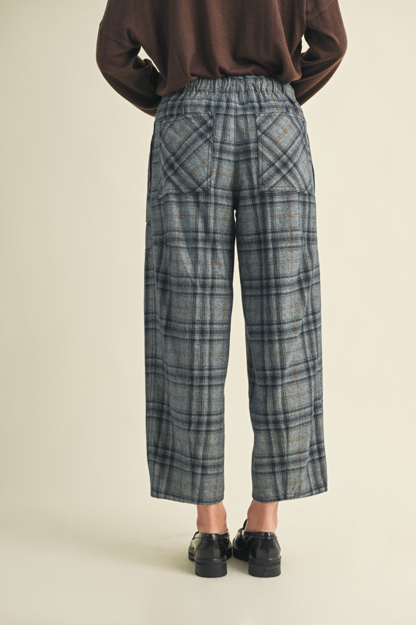Angled back view of Nice Choice pull-on plaid pants in washed denim with classic plaid print