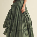 Front portrait of model wearing the One Brynn Cotton Tiered Maxi Skirt in dill green