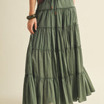 Front view of the One Brynn Cotton Tiered Maxi Skirt in dill (green) showing tiered silhouette