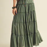 Front view of the One Brynn Cotton Tiered Maxi Skirt in dill (green) showing tiered silhouette