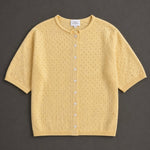 Piper Pointelle Cotton Button Down Cardigan in light yellow flat lay showing short sleeves, button front, and pointelle knit texture