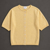 Piper Pointelle Cotton Button Down Cardigan in light yellow flat lay showing short sleeves, button front, and pointelle knit texture